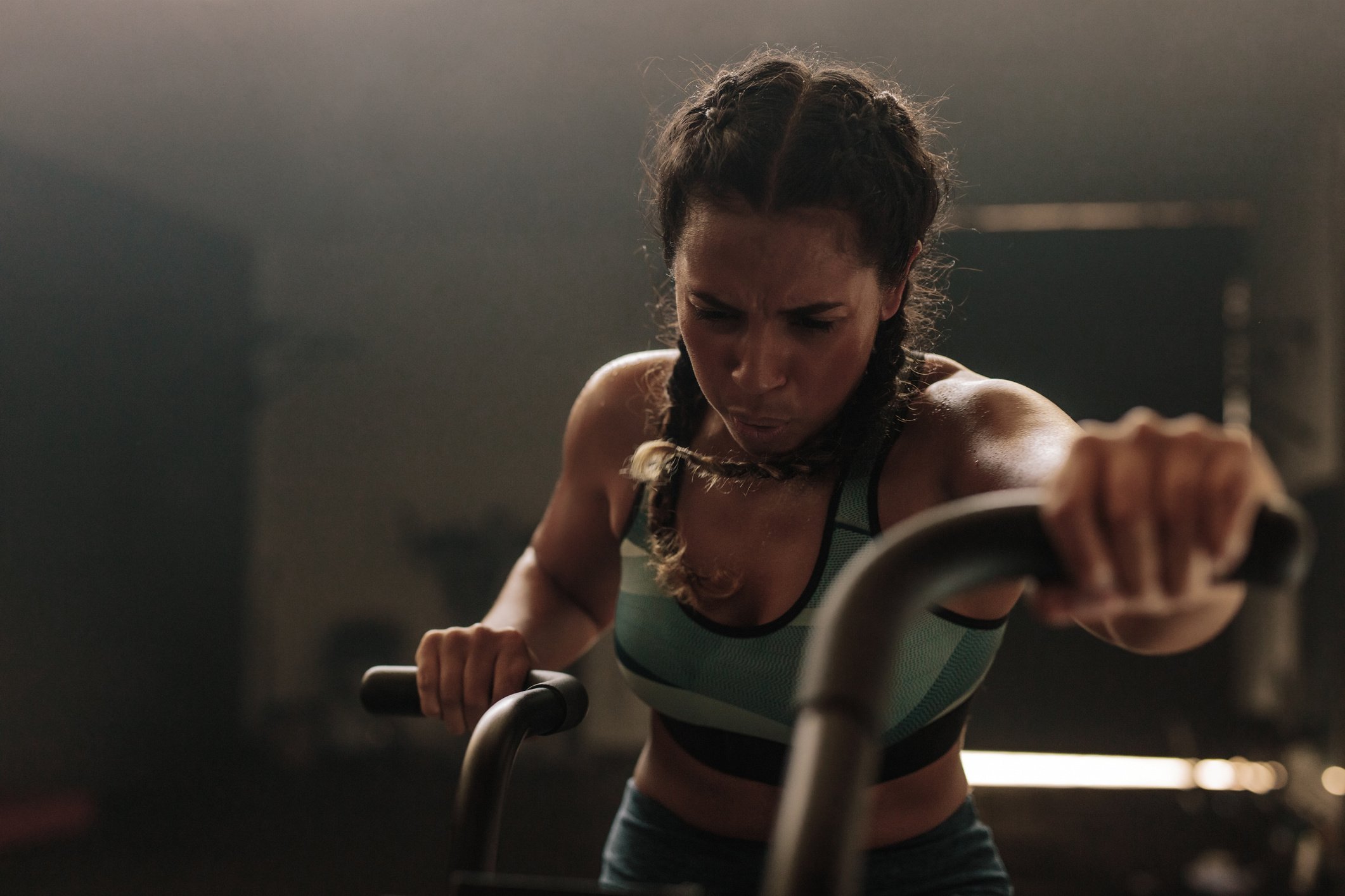 Woman Exercising Hard on Gym Bike